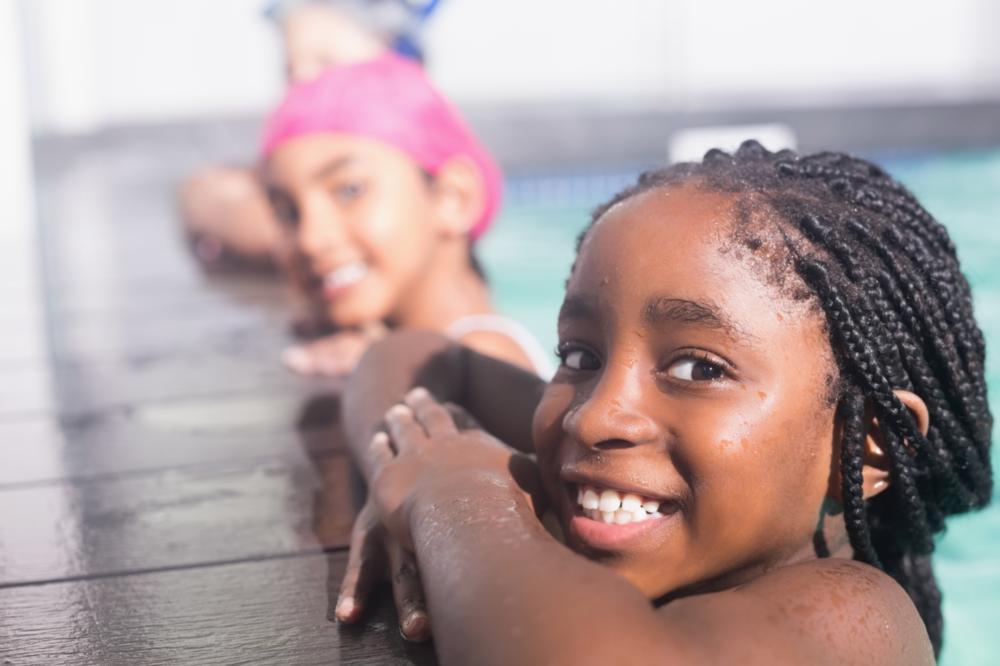 Girl smiling in swimming pool | Dentist Gretna LA