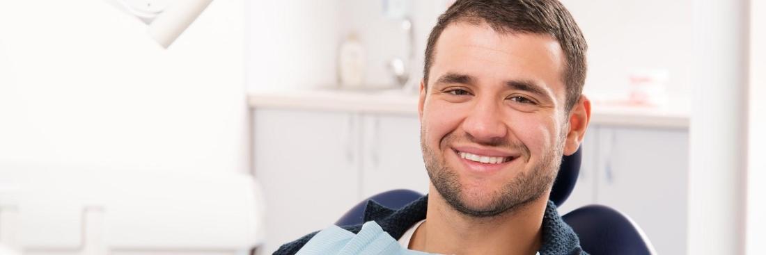 man smiling in dental chair 