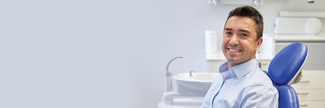 man smiling in dental chair | Dentist Gretna LA