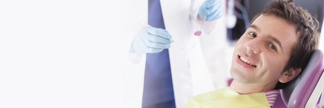 man in dental chair smiling | Dentist Gretna LA