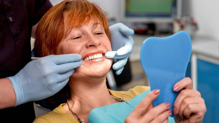 dentures gretna | woman at dentist