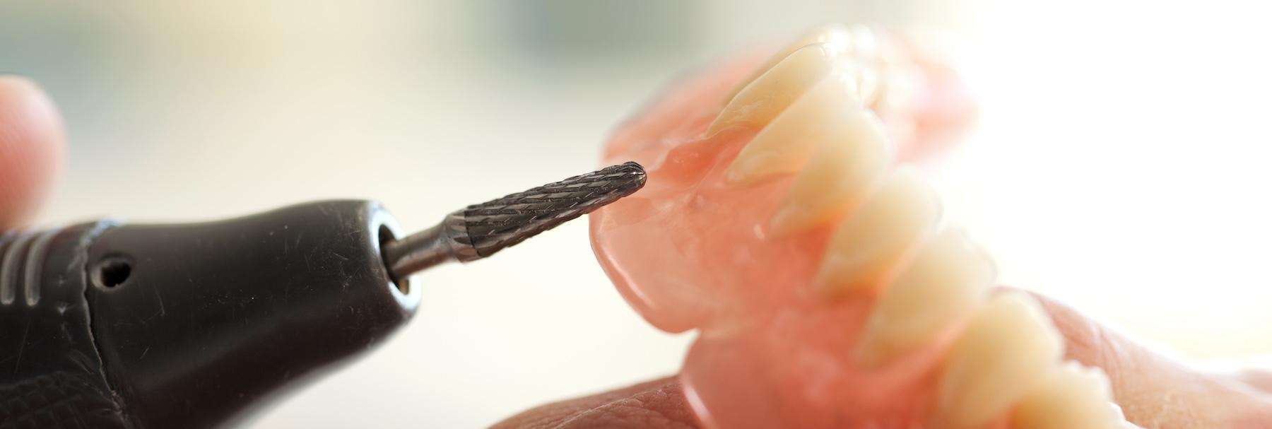 denture repair near me | dentures being fitted